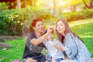 Asian teen family one kid happy holiday picnic moment in the park