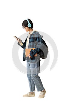 Asian teen girl holding smart phone and wearing headphones,