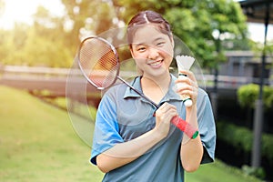 Asian Teen girl sport player with Badminton equipment for healthy outdoor portrait happy smile