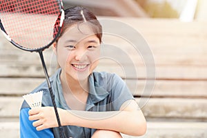 Asian Teen girl sport player with Badminton equipment for healthy outdoor portrait happy smile