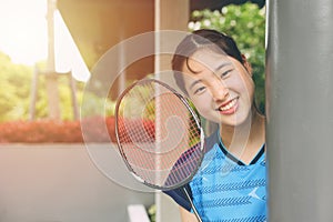 Asian Teen girl sport player with Badminton equipment for healthy outdoor portrait happy smile