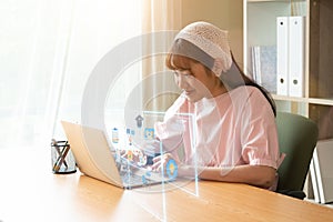 Asian teen girl using laptop computer study online during the covid-19 outbreak situation, Education technology at home concept