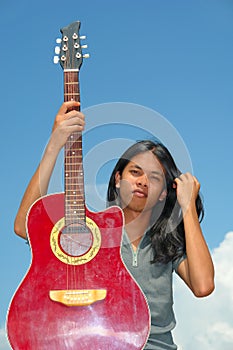 Asian teen with guitar