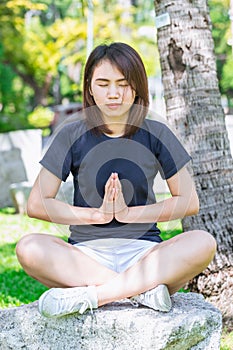 Asian teen sitting relax yoga concentration