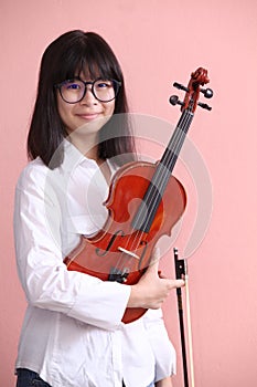 Asian teen with violin glasses smile