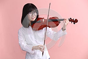 Asian teen with violin glasses