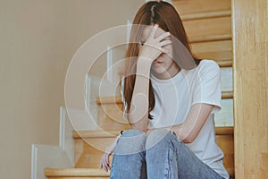 Asian teenage feeling depressed and lonely in the house. Stressed female from university study