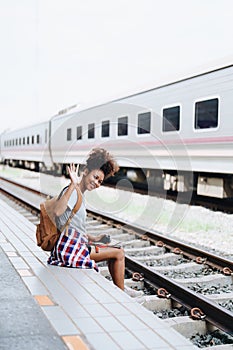 Asian teenage girl african american traveler dressed in casual wear holding map and searching right direction of route