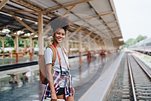 Asian teenage girl african american traveler dressed in casual wear holding map and searching right direction of route