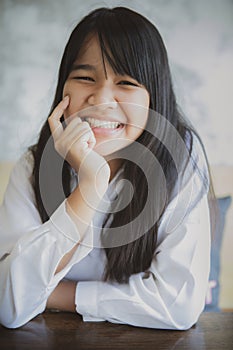 Asian teenager toothy smiling with happiness face