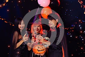 Asian Teenagers in Halloween Costumes, Celebrate The Enchanting Halloween Season. Celebrating Halloween Haunt Party of Asian Style