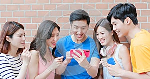 Asian teenagers use smartphone