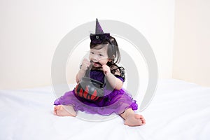 Asian Thai Cute Baby Girl in Witch Costume, Halloween Day