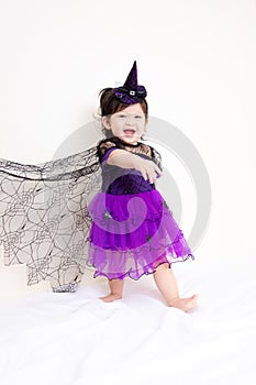 Asian Thai Cute Baby Girl in Witch Costume, Halloween Day