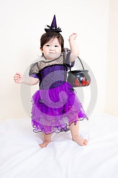 Asian Thai Cute Baby Girl in Witch Costume, Halloween Day