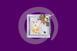 Asian Thai food on white plates with purple background with copy