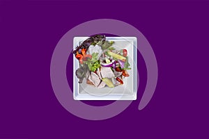 Asian Thai food on white plates with purple background with copy