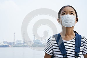 Asian thai girl wearing protective mask or hygienic mask in smog day