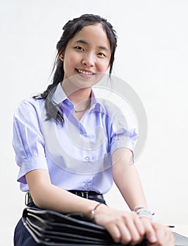 Asian Thai high schoolgirl student in school uniform isolated