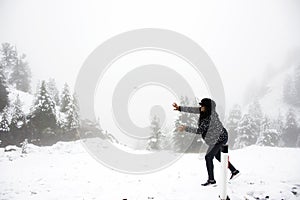 Asian thai old woman playing snow ball at top of mountain