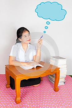 Asian Thai Student points the cloud of idea photo