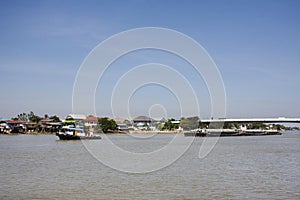 Asian thai worker people sailing barge and tugboat cargo ship delivery shipping in Chao Phraya or chaopraya river from Bangkok go