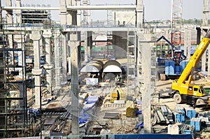 Asian thai workers and heavy machinery working builder new building at construction site high-rise building in Bangkok, Thailand.