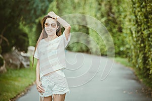 Asian thin hipster girl wearing sunglasses walking smiling