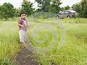 Asian toddler in countryside