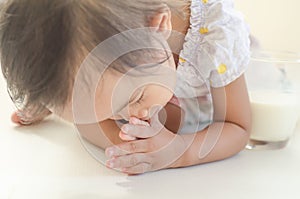 Asian toddler girl prostrate herself to elder for thanks