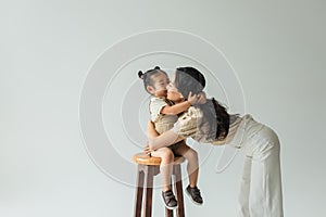 asian toddler girl sitting on chair