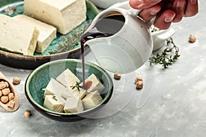 Asian tofu meal with soy sauce topping, Food recipe background. Close up