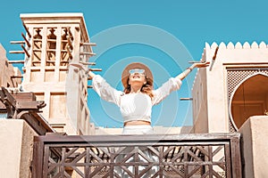 Asian tourist girl walks through the old Arab city in Dubai, United Arab Emirates