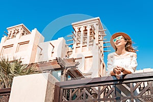 Asian tourist girl walks through the old Arab city in Dubai, United Arab Emirates