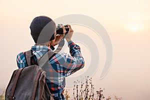 Asian tourist shooting picture in nature