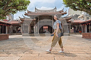 Asian tourist walking in the temple.