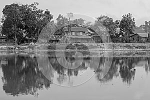 Asian traditional village near of small lake in black and white