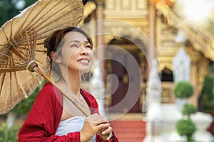 Asian traveler walking in old pavillion in Temple