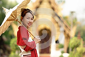 Asian traveler walking in old pavillion in Temple