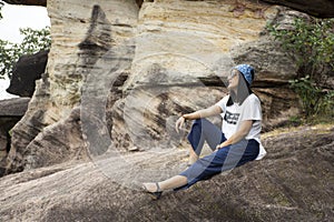 Asian travelers thai women travel and posing at Sao Chaliang in Pha Taem National Park