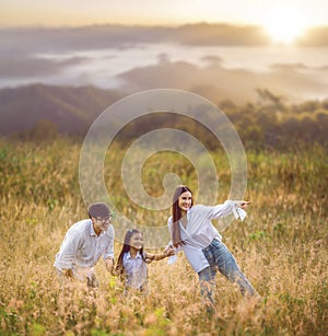 Asian traveller family walking on morning sunrise time togather