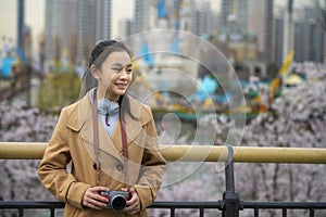 Asian traveller girl travel in seoul city with her digital camera