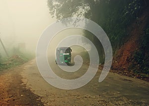 Asian tuk-tuk in morning fog
