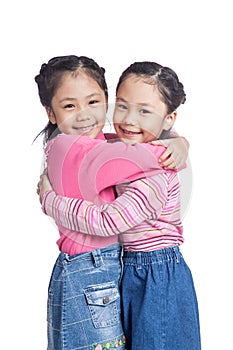 Asian twin sisters hug each other with love