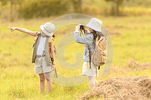 Asian two friend children take a photo and walking with adventure and tourism for destination and leisure trips for education and photo