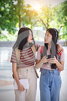 Asian university students chating, talking in university campus