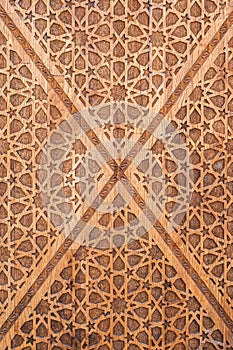 asian Uzbek Islamic patterns ornament with stars on modern wooden carved door in Uzbekistan close-up