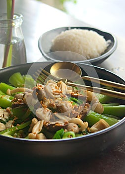 Asian, vietnamese cuisine. Steamed bok choy with stir fried mushrooms and steamed rice on the side. Close up shot.