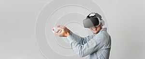 Asian wearing VR  headset man have fun with video game playing