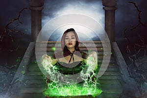 The asian witch with cauldron practice witchcraft